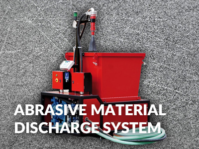 Abrasive material discharge system
